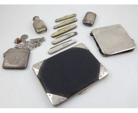 A George V silver mounted, black leather wallet, an engraved silver vesta on chain, two silver bladed mother of pearl fruit k