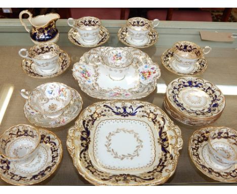 A late 19th century Davenport part tea /dessert service, decorated with gilt highlighted foliage on cream and indigo ground, 