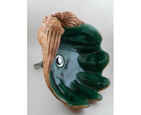A Portuguese green glazed earthenware counter top basin modelled as a clam shell. W. 46cm together with a Portuguese oval mos