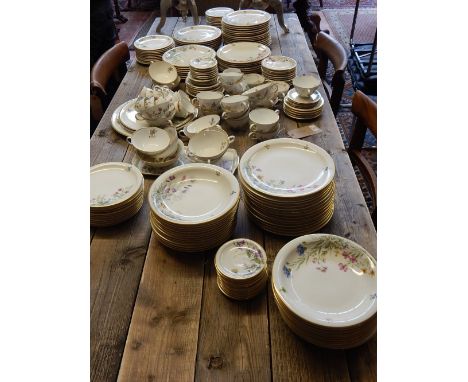 A 20th century dinner and tea service by K & A Krautheim, decorated with summer flowers on a cream ground, including includin