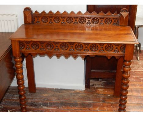 A late Victorian oak hall table on bobbin turned legs, W. 105cm.
