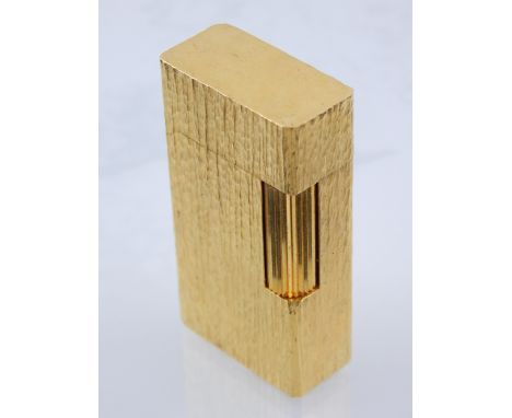 A Waterman's gold plated cigarette lighter of rectangular form. 