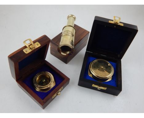 A brass three draw telescope within a wooden box, together with a compass and a 111 year calendar, (3).