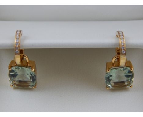 Kiki McDonough. A pair of of 18 carat yellow gold, diamond, and prasiolite (green amethyst) drop earrings, having detachable 