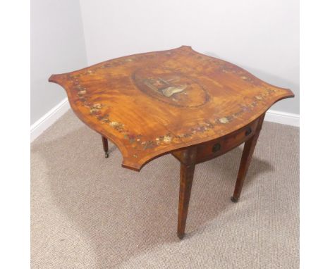 An Edwardian Sheraton revival satinwood and painted Pembroke Table, the quarter-veneered serpentine-shaped top with central i