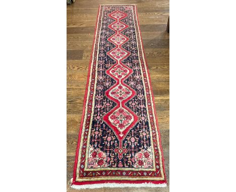Tribal Rugs: a Persian Senneh hand knotted narrow wool runner,&nbsp;blue ground with dark pink borders, the whole woven with 