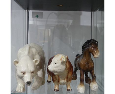 A Melba Ware Hereford Bull, with factory marks below, 26cm long, together with a Melba Ware Polar Bear and a Beswick Horse (3