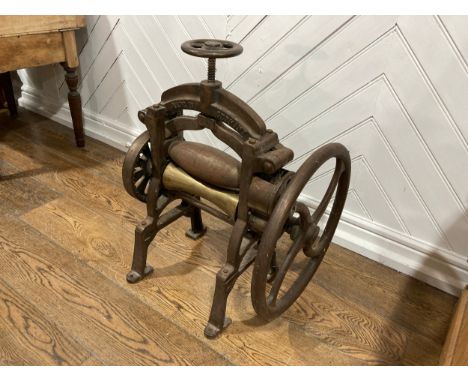 An antique cobblers leather roller mangle by Gustav Rafflenbeul Schwelm, W 53cm x H 70cm x D 48cm. 