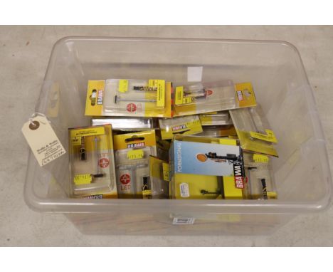35 individually packed Brawa accessories for N gauge model railways. Including Angular Headlight, Double Curved Arm Light Pin