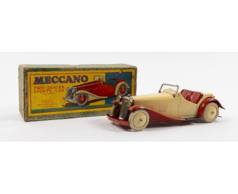 A rare Meccano clockwork Non Constructor Car. A Two-Seater Sports Car in cream with red seats, mudguards, black running board