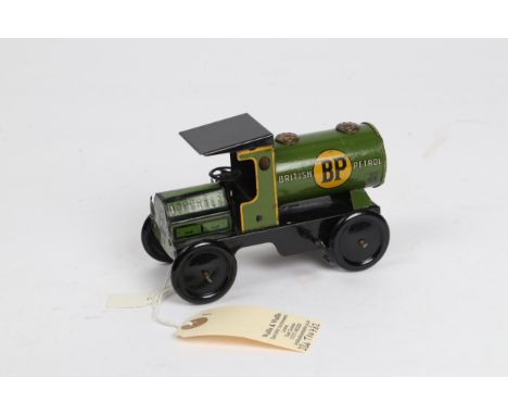 A scarce Wells of London tinplate fuel tanker. In green with lined cab, and BP to the tanks. Wind up motor in working order, 