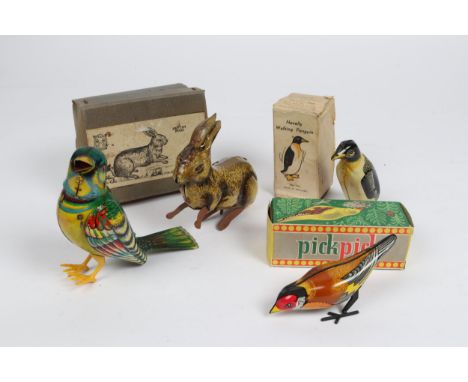 4 Tinplate Animal related toys, KOHLER multicoloured songbird in working order, a novelty walking Penguin by Wells Brimtoy in