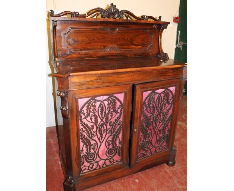 Victorian rosewood chiffonier with raised shelf above two fretwork doors, 146cm high and 108cm wide.