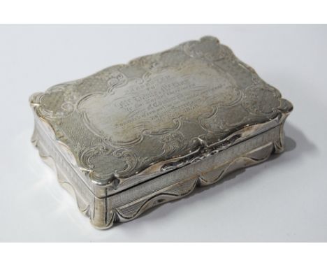Silver snuff box, rectangular, with shaped notched edges, engraved all over with scrolls, 'Mr Daniel McKay...Market Gardiners