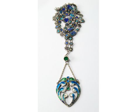 Silver and enamel pendant of Scottish Arts & Crafts style in shades of blue and green upon a similar long chain, c. 1900.150 
