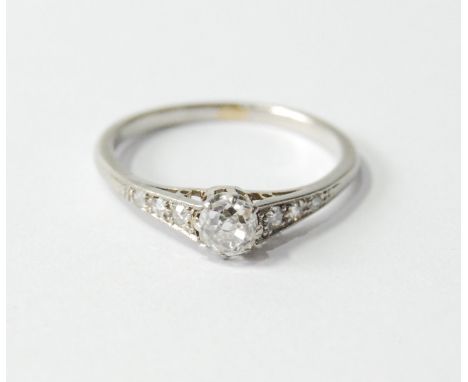 Diamond solitaire ring with old-cut, almost cushion-shaped brilliant, approximately .30ct, with diamond-set shoulders, in pla