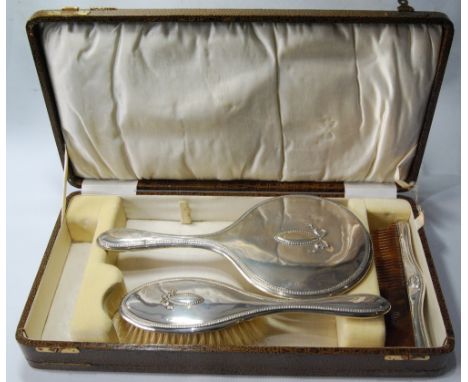 Silver-mounted brush, mirror and comb, Birmingham 1912.