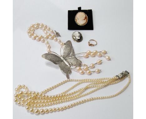 Imitation pearl and silver butterfly necklet, another, two cameo brooches and a ring.