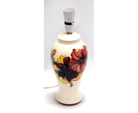 Moorcroft Orchid pattern table lamp with white ground, 26cm high.