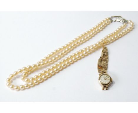 Lady's Rotary 9ct gold bracelet watch and an imitation pearl necklet.