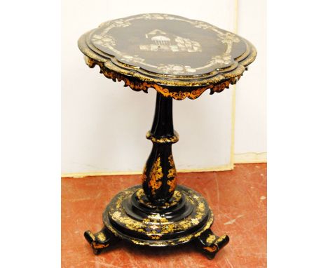 Victorian gilt papier mache and mother of pearl oval table, the top inlaid with a church, 71cm high and 67cm wide.