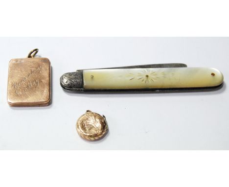 Two gold lockets and a silver and mother of pearl fruit knife.  (3)