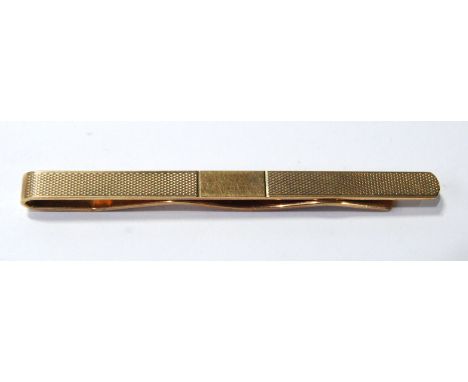 9ct gold tie clip, engine turned. Condition Report 7.9g