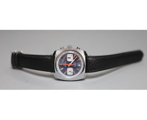 A gentleman's 1970's stainless steel Mondaine chronograph blue dial manual wind wrist watch, in later leather strap.CONDITION