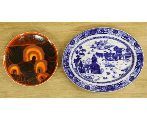 A Poole pottery charger and a blue and white oval Ashworth dish, length 55cm