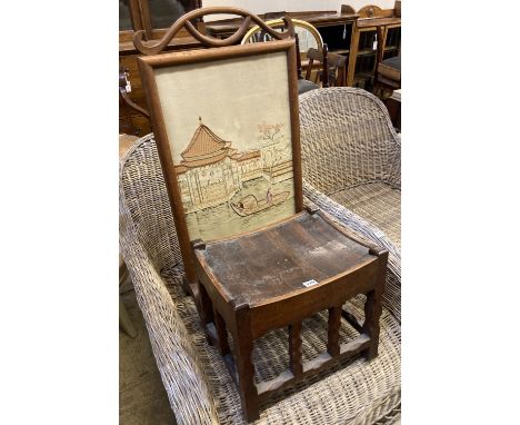 An Arts &amp; Crafts rectangular chip carved oak stool, width 43cm, depth 34cm, height 38cm, together with an embroidered fir