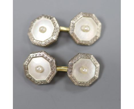 A pair of 1940's 14c, plat and mother of pearl octagonal cufflinks, gross 8 grams.CONDITION: Both are in good condition.