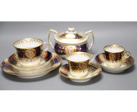 An early 19th century Chamberlains Worcester imari-style graduated set of three cups and saucers, a plate and a sucrier and c