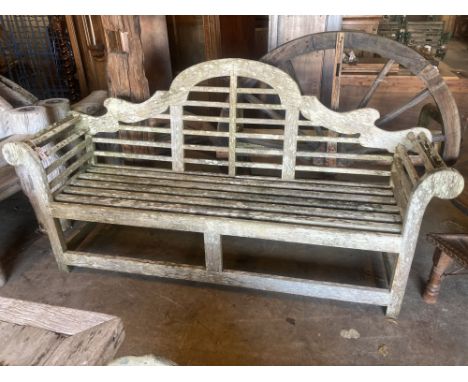 A vintage Lutyens design weathered teak garden bench, width 196cm depth 50cm height 106cmCONDITION: Very weathered but sturdy