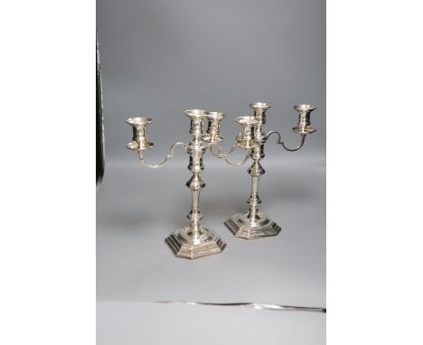 A pair of George I style silver two-branch three-light candelabra, Birmingham 1967, Makers: Elkington &amp; Co, height 31.4cm