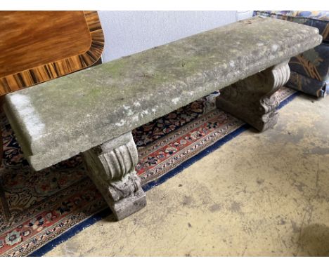 A reconstituted stone garden bench seat, length 126cm, depth 38cm, height 45cm