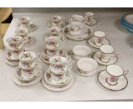 A Royal Albert 'Moss Rose' pattern tea service (41-pce) and a set of four Coalport botanical cups and saucers