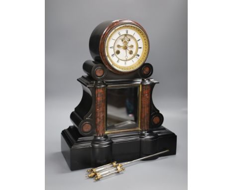 A Victorian black slate and rouge marble mantel clock, height 46cm