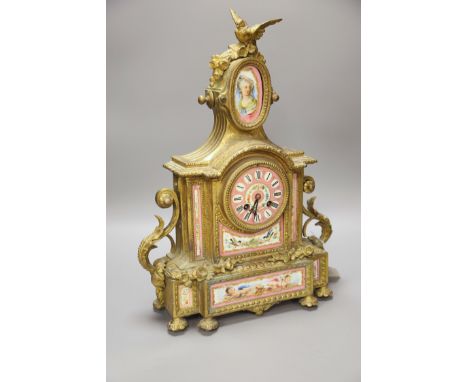 A French gilt metal mantel clock with Sevres-style panels, height 46cm