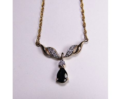 9 ct gold sapphire and diamond set pendant. 4.7g