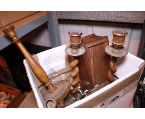 Box of treen including a pair of corkscrew candle sticks 