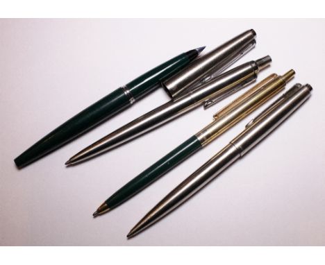 Three Parker pens and a Papermate pen