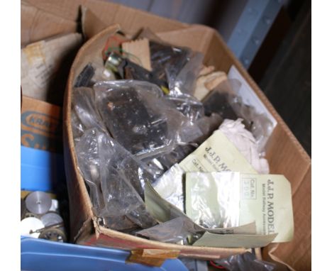 Box of model train set mechanisms and wheels
