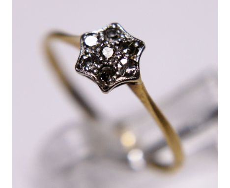 18 ct gold diamond flower ring. size N