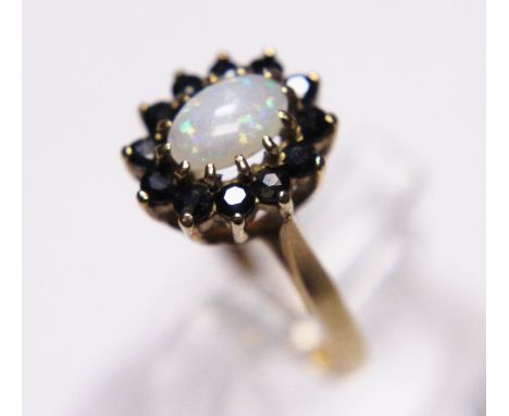 9 ct gold opal and sapphire ring. size L