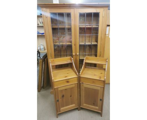 A five shelf pine display cabinet with a pair of pine bedside cabinets, 93 x 42 x 41cm, cabinet 182 x 122 x 29cm.