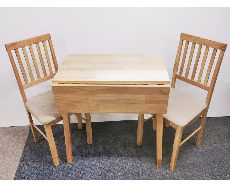 A light oak drop leaf kitchen table with a pair of matching chairs, table 90 x 75 x 76cm.