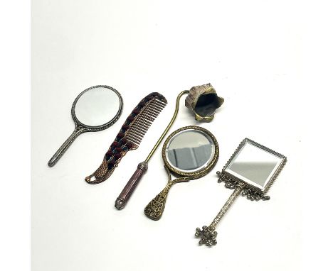 Three interesting hand mirrors, comb and candle snuffer, longest L. 15cm. Prov Jean Rich collection.