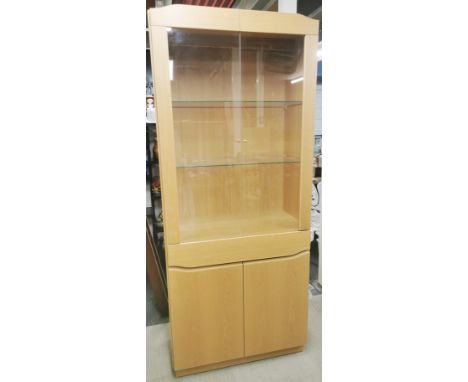 A Danish Skovby light oak, single drawer display cabinet with glass shelves and fitted lighting, model SM352E, 195 x 83 x 41.