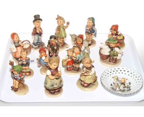 Collection of fourteen Hummel figures and pierced dish