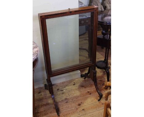 19th Century mahogany and ebonised firescreen, with three sliding glass panels